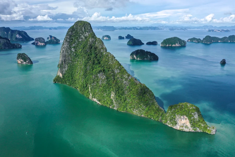 Sunrise over Phang Nga Bay with limestone karsts and calm turquoise water